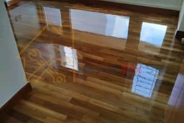 A high-gloss, newly polished and varnished wooden parquet floor in a Singapore home by Home Fix SG.