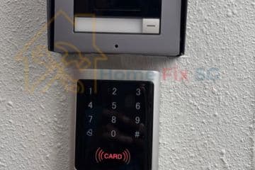 A modern wall-mounted RFID card reader and digital keypad access control system installed by Home Fix SG in Singapore.