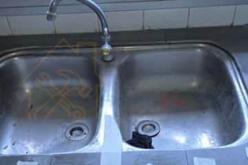Double bowl stainless steel kitchen sink repair and plumbing service in Singapore by Home Fix SG.